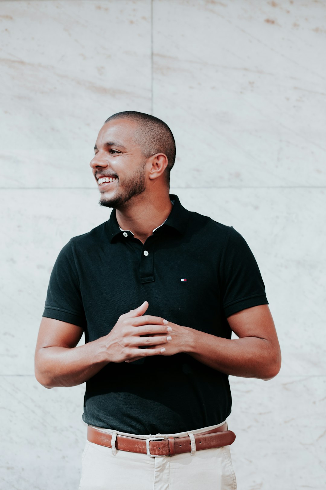 Man wearing a dark polo shirt